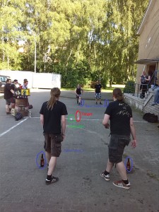 Two Teams playing Flunky Ball. Red = the "target" Green = the "projectile"